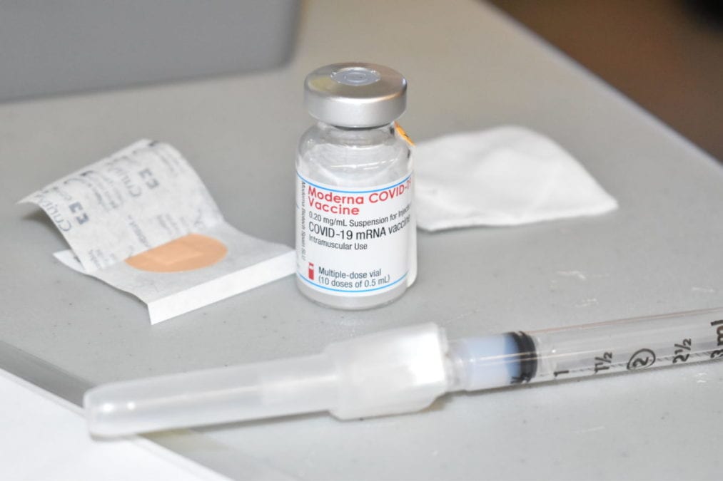 An empty Moderna vial sits on a table after a nurse administered a vaccine to a resident of Wekweeti on Wednesday. Blair McBride/NNSL photo