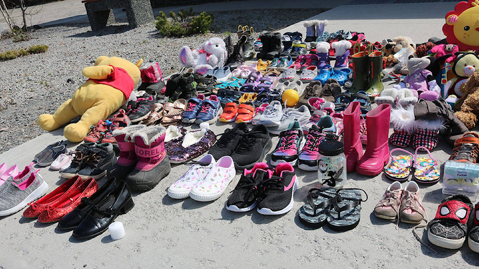 25370861_web1_210502-YEL-KamloopsVigil4-Shoes2_1