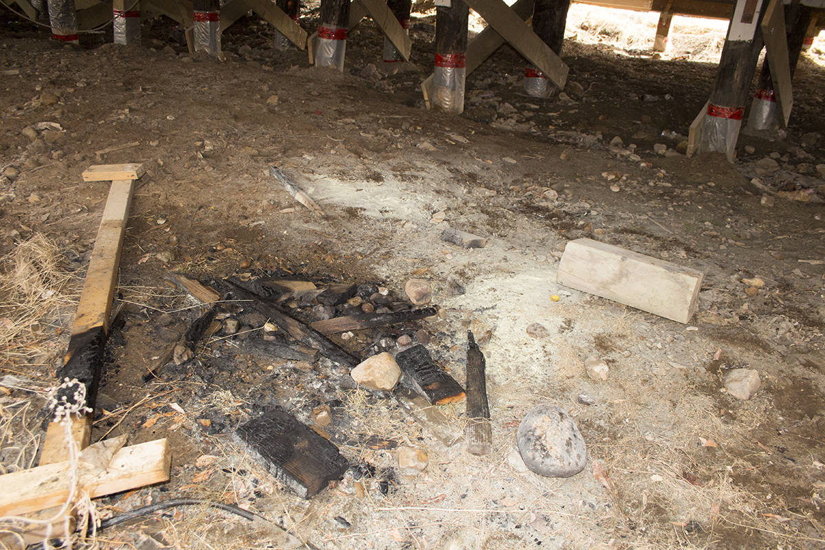 The remains of an attempted fire a group of indivuduals lit underneath McCauley Place early June 3. Eyewitnesses say chicken wire normally around the base of the building had fallen down, allowing the people access. Eric Bowling/窪蹋勛圖厙 photo