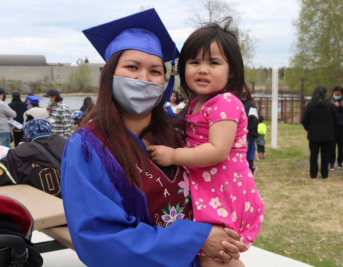 Kristalynn Jerome of Fort McPherson had lots to celebrate with her personal support worker certificate. With her is her daughter Zoey Jerome, 22 months. Simon Whitehouse/窪蹋勛圖厙 photo
