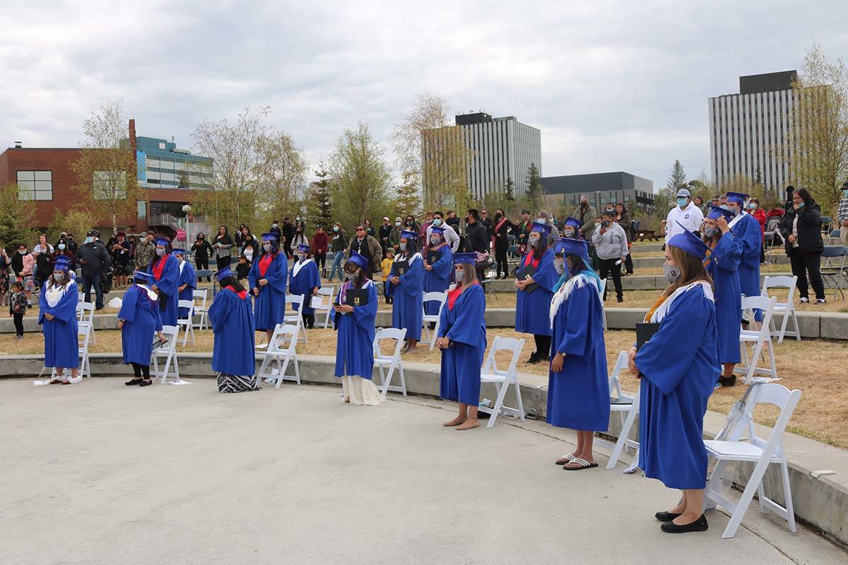 Students stand for a recessional procession at the end of the ceremony. Simon Whitehouse/窪蹋勛圖厙 photo