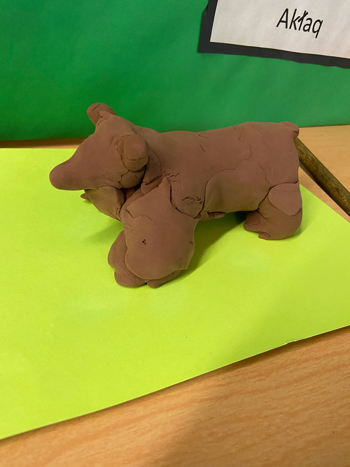 A clay sculpture of a Grizzly bear made by a third grade student as part of the cultural exhibit. Students not only learned about the biology of the Arctic Coast, they learned how to speak it in Inuvialuktun. photo courtesy of Beaufort Delta Divisional Education Council