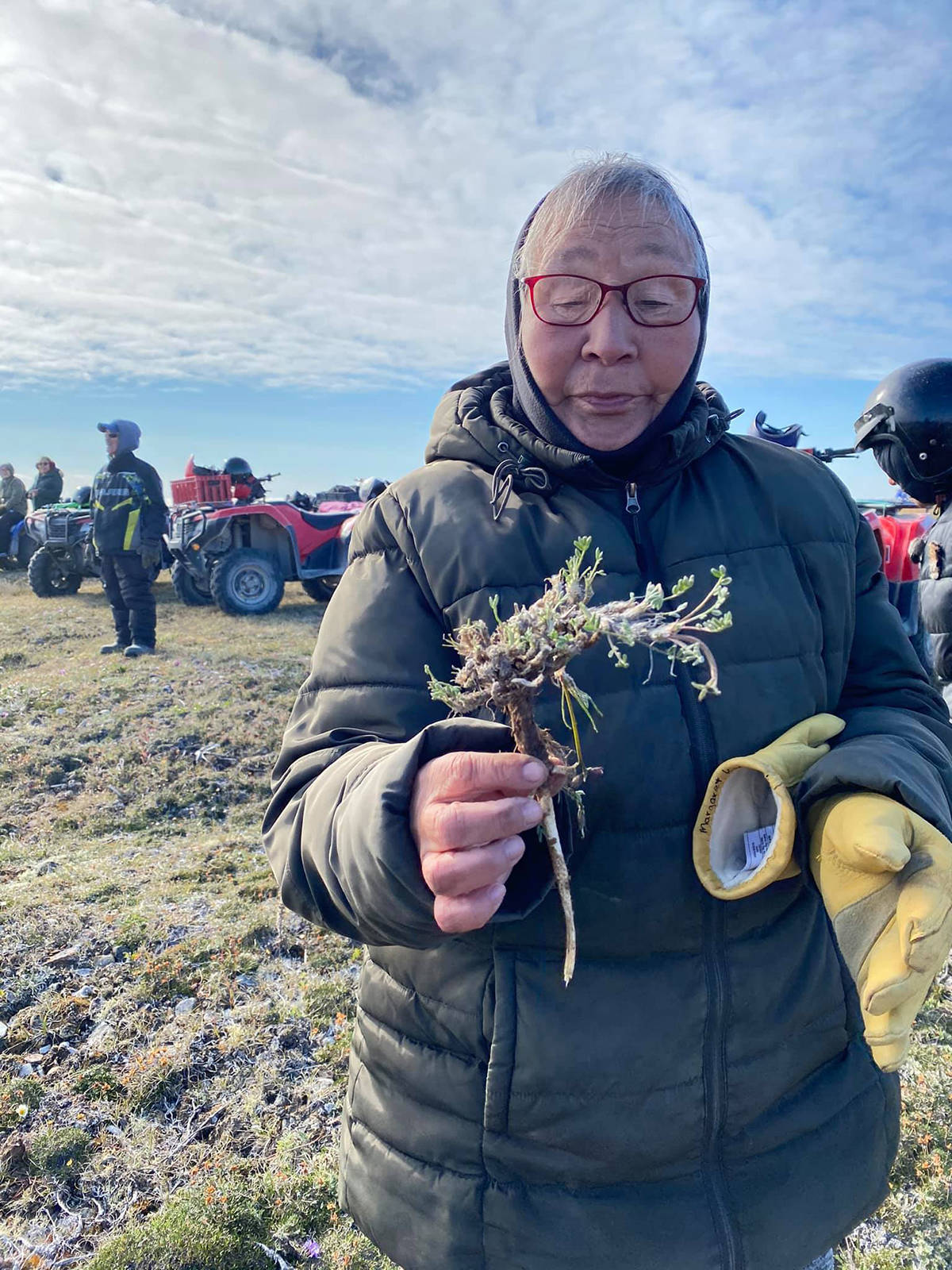 Margaret Kanayok holds some Masu (roots) she collected for food as part of the Ulukhaqtuuq Youth Wellness Gathering July 25-30. It was an opportunity for Inuvialuit from across the Western Arctic to connect and learn their heritage. Photo courtesy of Western Arctic Youth Collective