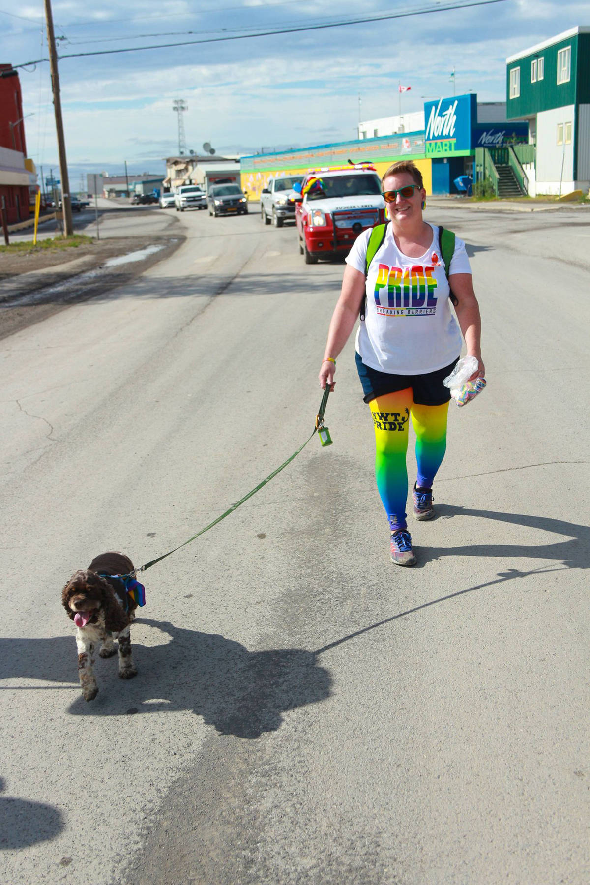 Town of Inuvik Mayor Natasha Kulikowski walks her dog Cleo during the town’s Pride March June 26. Kulikowski said she’s decided to step back from the Mayor seat after one term and run for council instead. Eric Bowling/ϳԹ photo