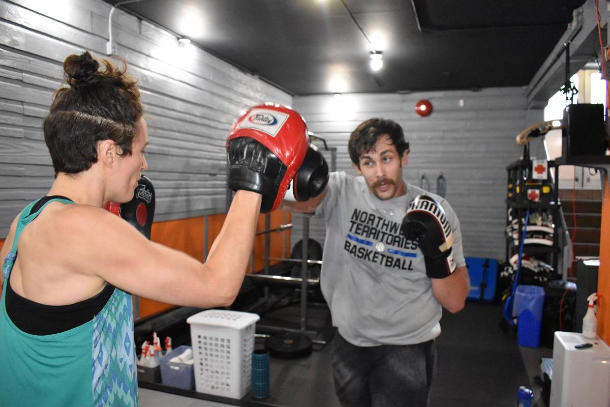 Celia Harding-Russell uses a pad to receive a jab from Matt Craig. Blair McBride/NNSL photo