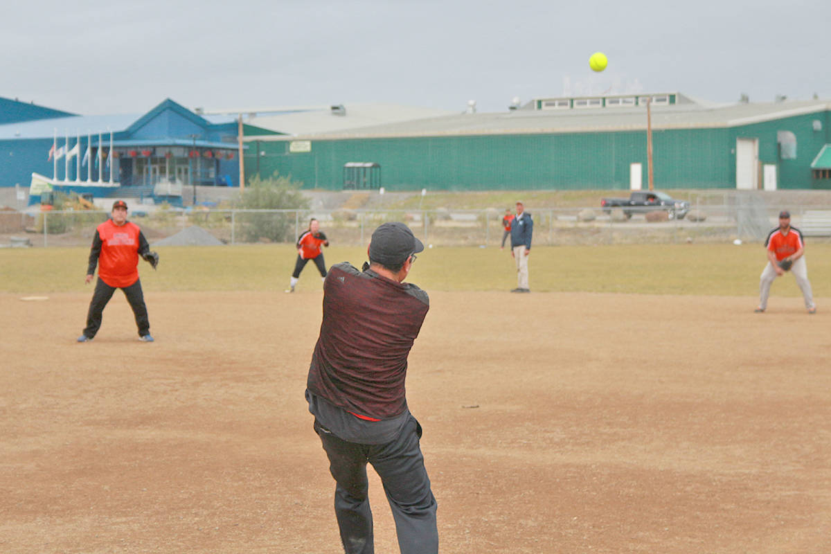 Pat-Brian Tingmiak lets one fly during the opening game of the tournament as fans watch on. Eric Bowling/NNSL photo