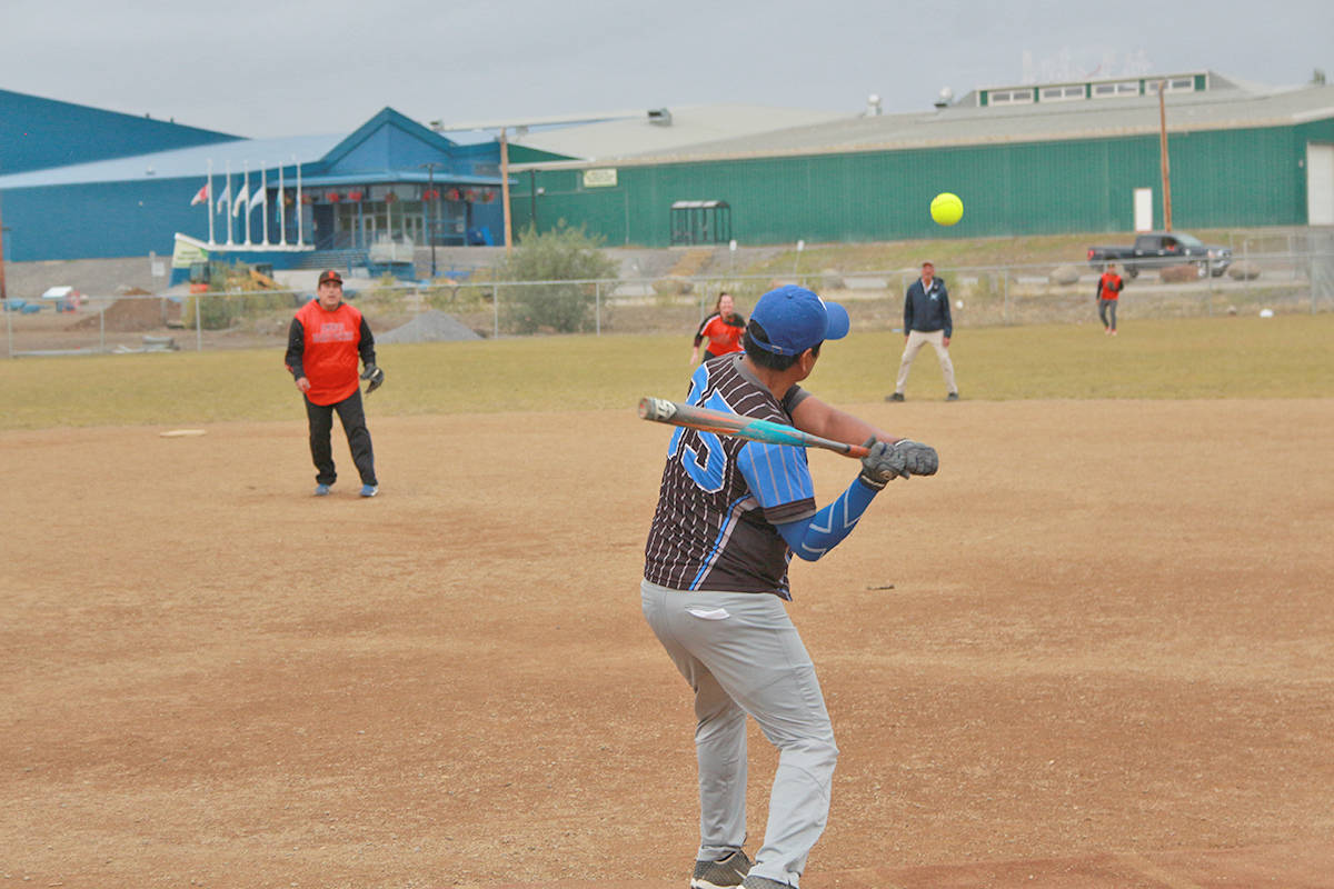 Clinton Gordon prepares to wallop an incoming pitch as the outfielders ready for action. Eric Bowling/NNSL photo