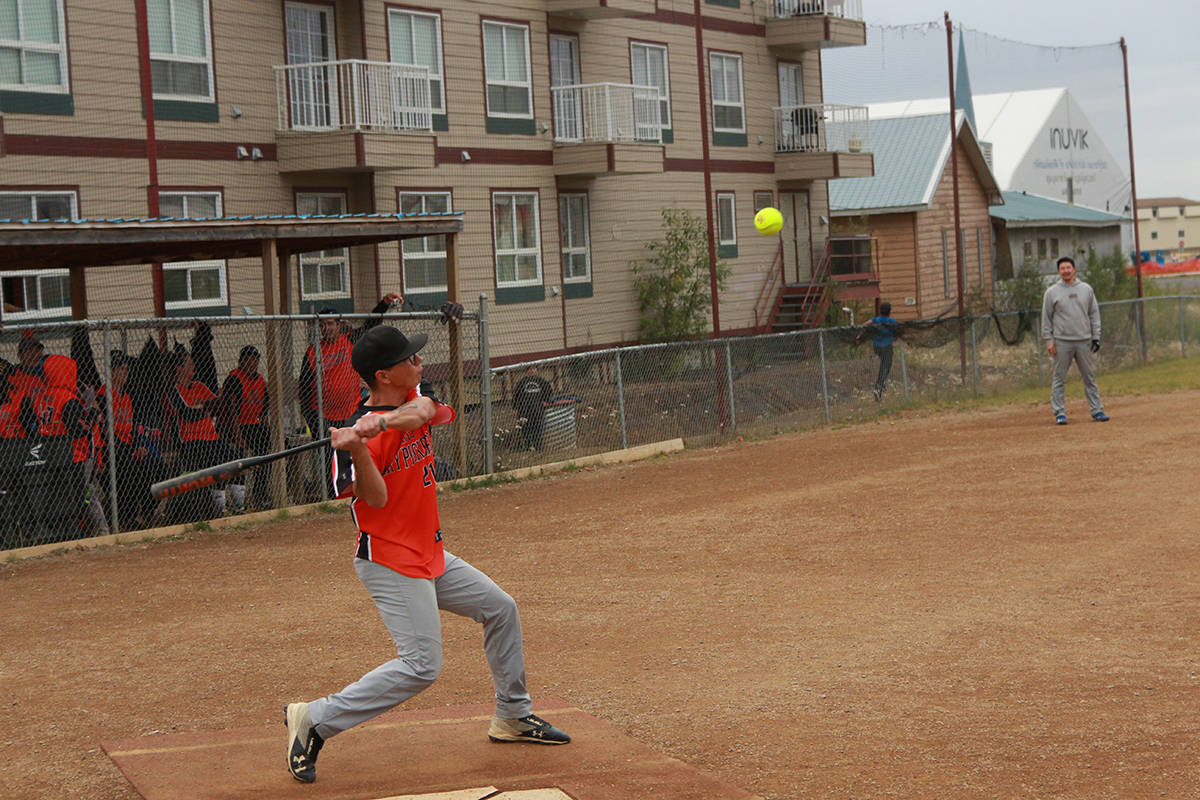 Sasha Nogasak steps forward to take a swing at an incoming pitch. Eric Bowling/NNSL photo