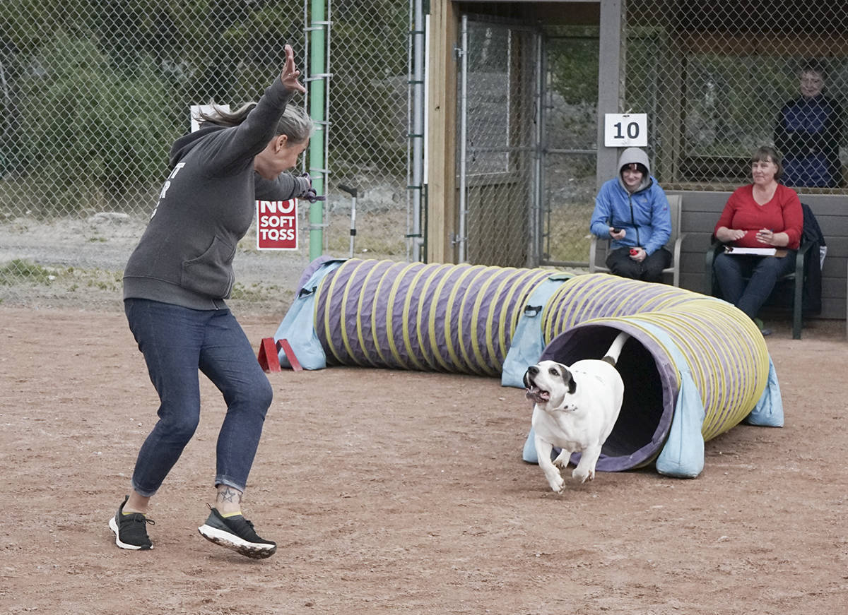 Karen Wasicuna celebrating Lucy finishing the Rruff Diamonds Dog Agility meet on Aug. 29. Andrea Eymann/NNSL photo