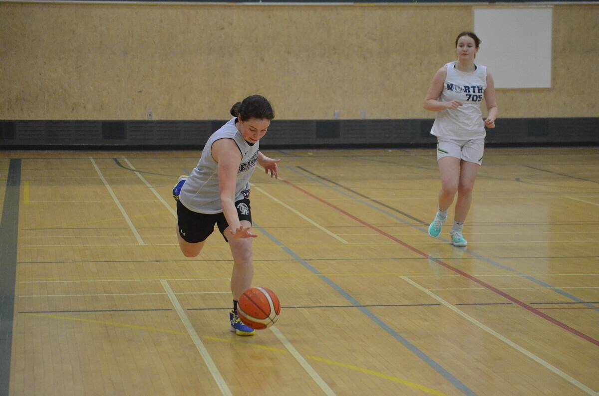 Effie Lockhart tries to control the bouncing ball during the U19 Eagles Basketball tryouts at St. Pats Gymnasium on Saturday. James McCarthy/窪蹋勛圖厙 photo