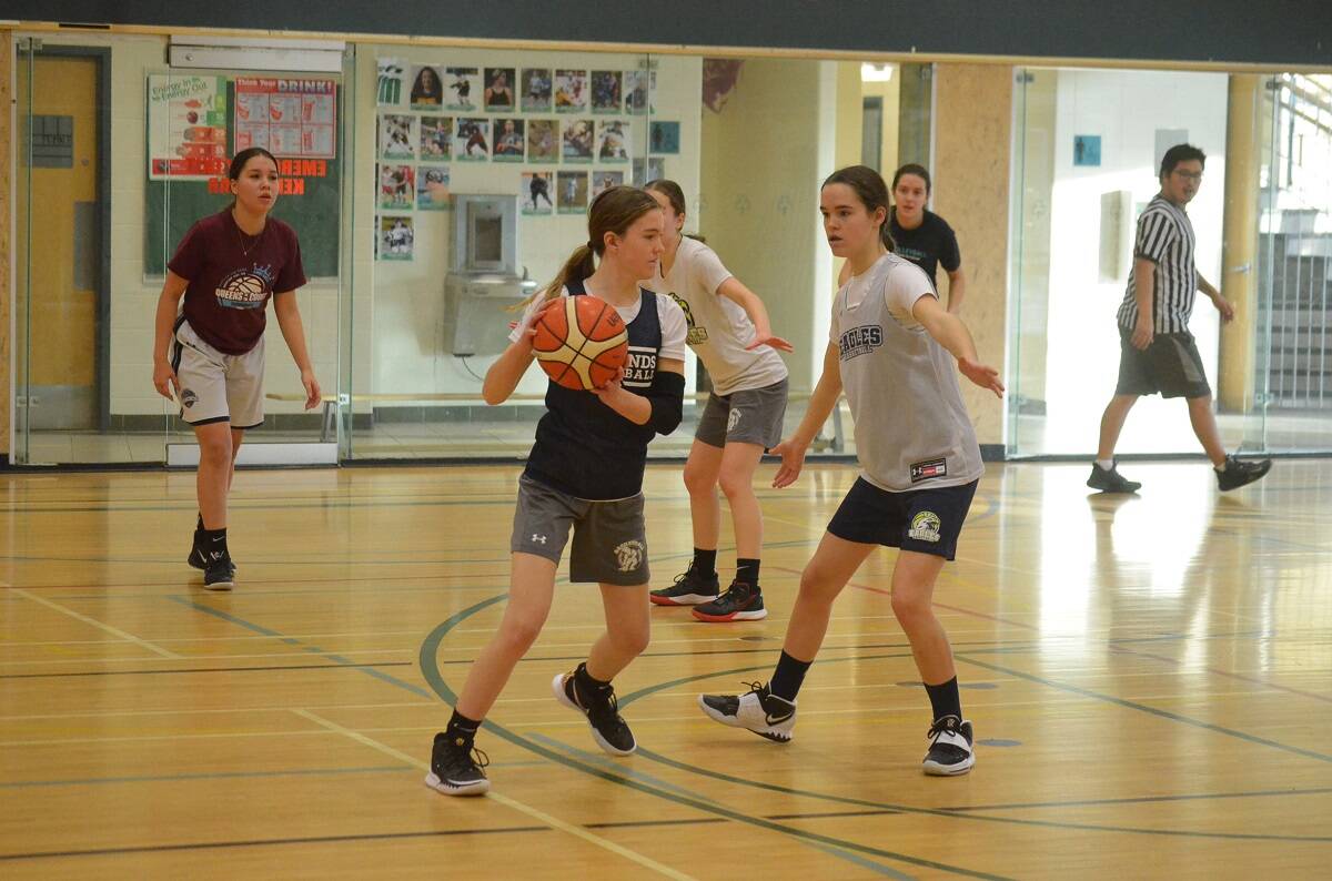 Its sibling vs. sibling as Mia Locke-Setter, left, looks for a passing option while being guarded by Kaylie Locke-Setter during the U19 Eagles Basketball tryouts at St. Pats Gymnasium on Saturday. James McCarthy/窪蹋勛圖厙 photo
