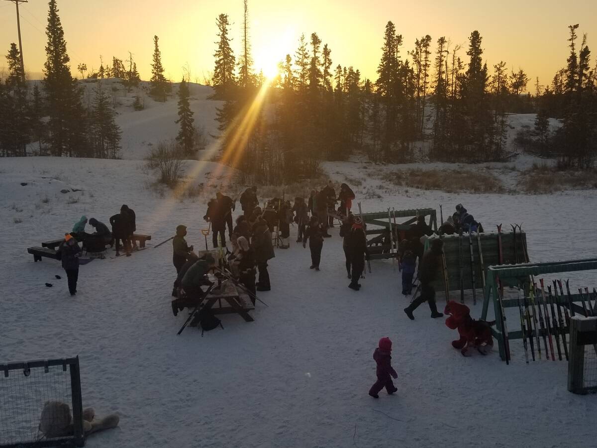 The sun breaks through the trees as the ski swap begins at the Yellowknife Ski Clubs Snow Show on Saturday. Photo courtesy of Bernadette Knox