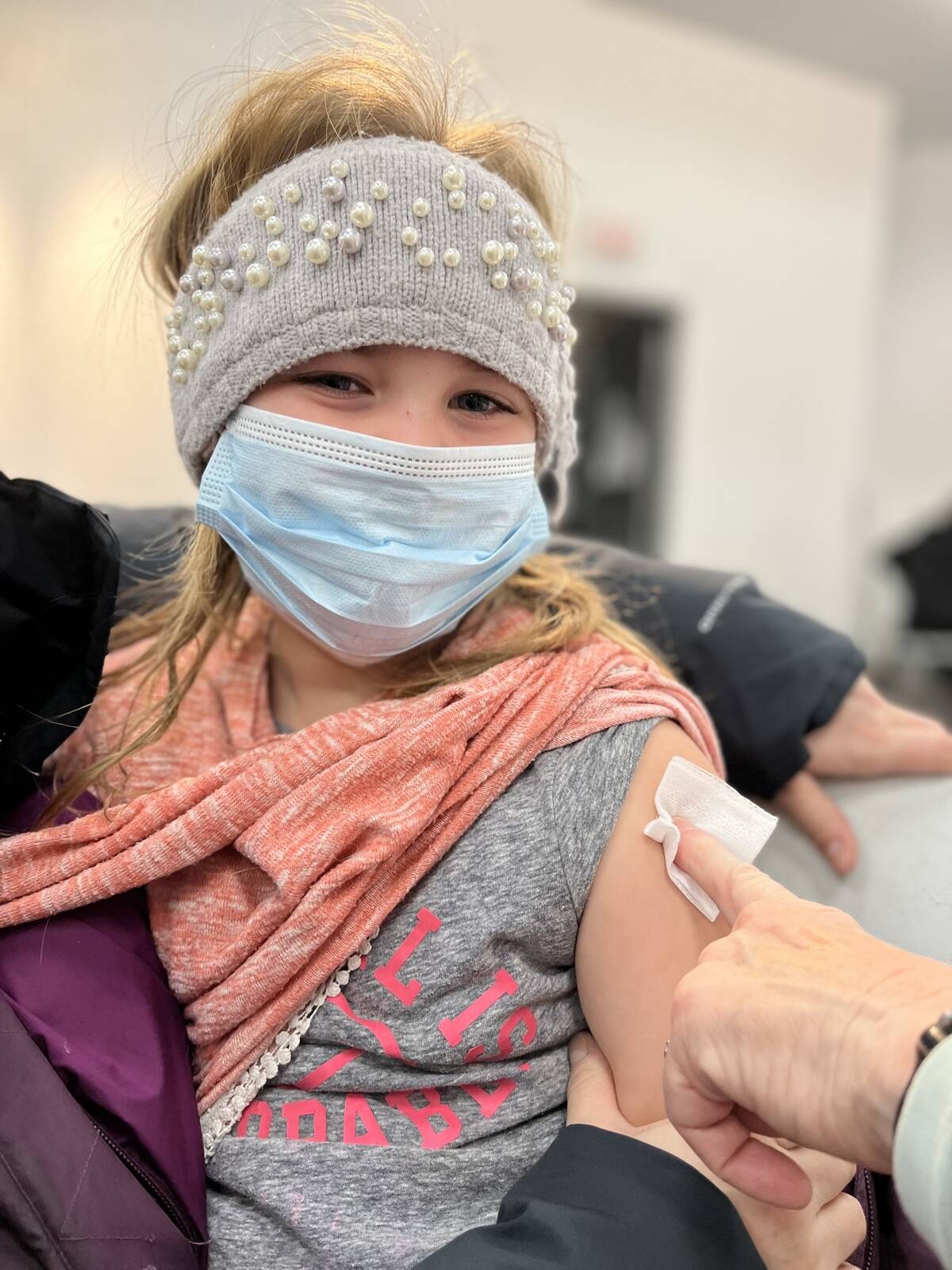 Reverie Letts, 6, receives her Pfizer dose at the Centre Square Mall clinic. Photo courtesy of Daron Letts