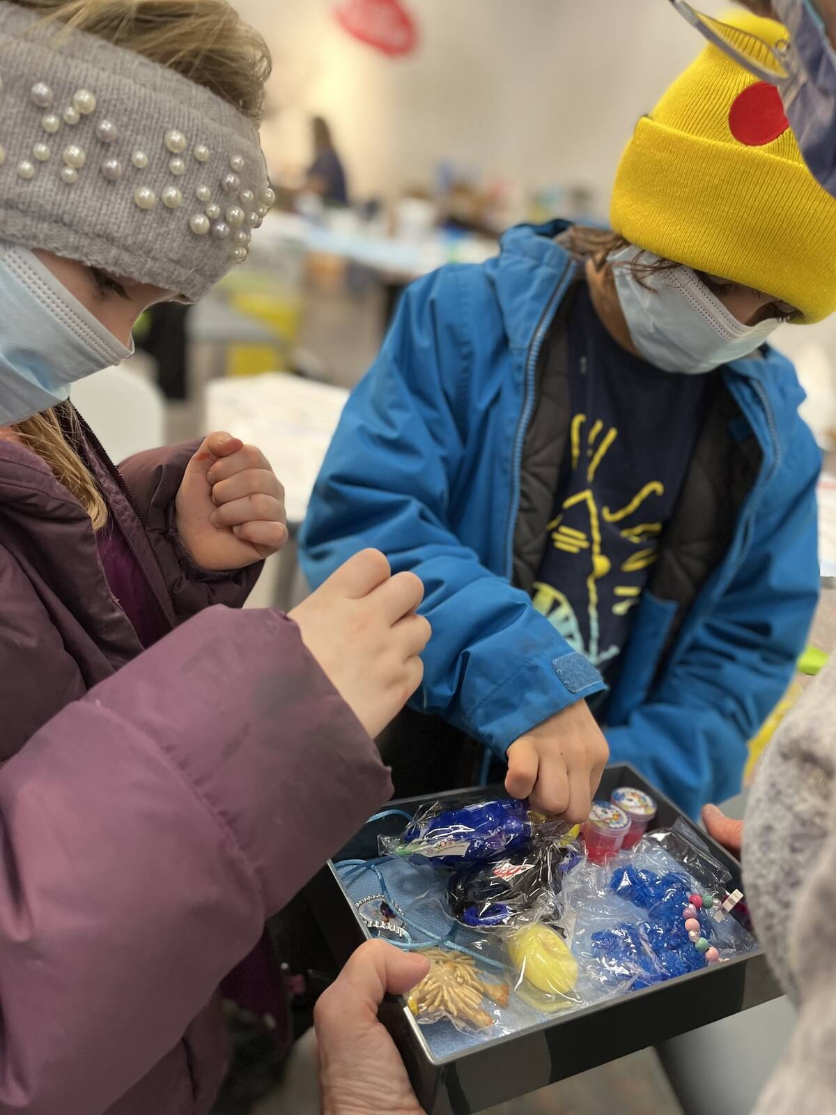 Reverie Letts and Osler Letts pick a toy out of a box for their visit to the clinic at the Centre Square Mall, by appointment. Photo courtesy of Daron Letts