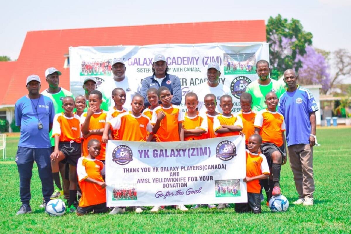 Dillon Torindo, back row in centre, went back to his birthplace of Zimbabwe in October to start up Yk Galaxy-Zimbabwe with his father, Edward Torindo. The elder Torindo serves as the technical director of the Zimbabwe academy. Photo courtesy of Yk Galaxy