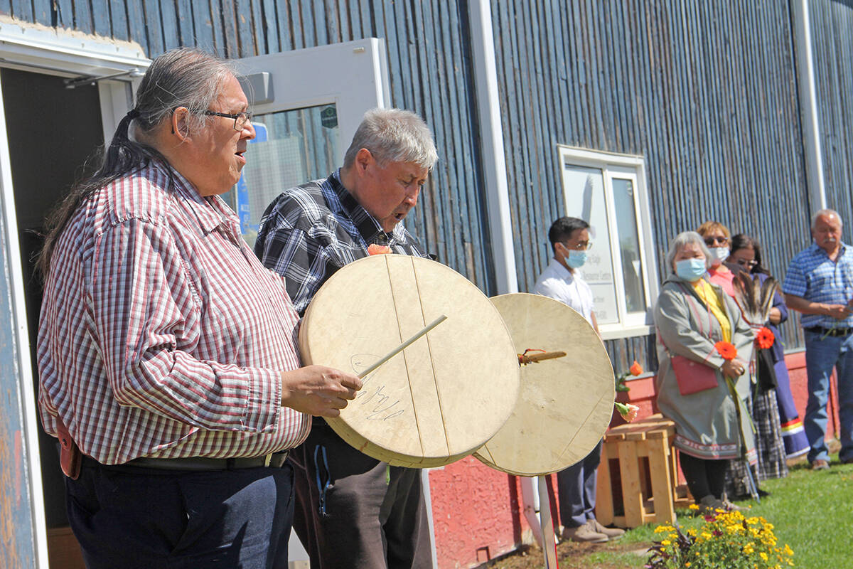 Roy Fabian, left, and Frank Fabian perform a prayer song in front of Soaring Eagle Friendship Centre June 4. NNSL file photo