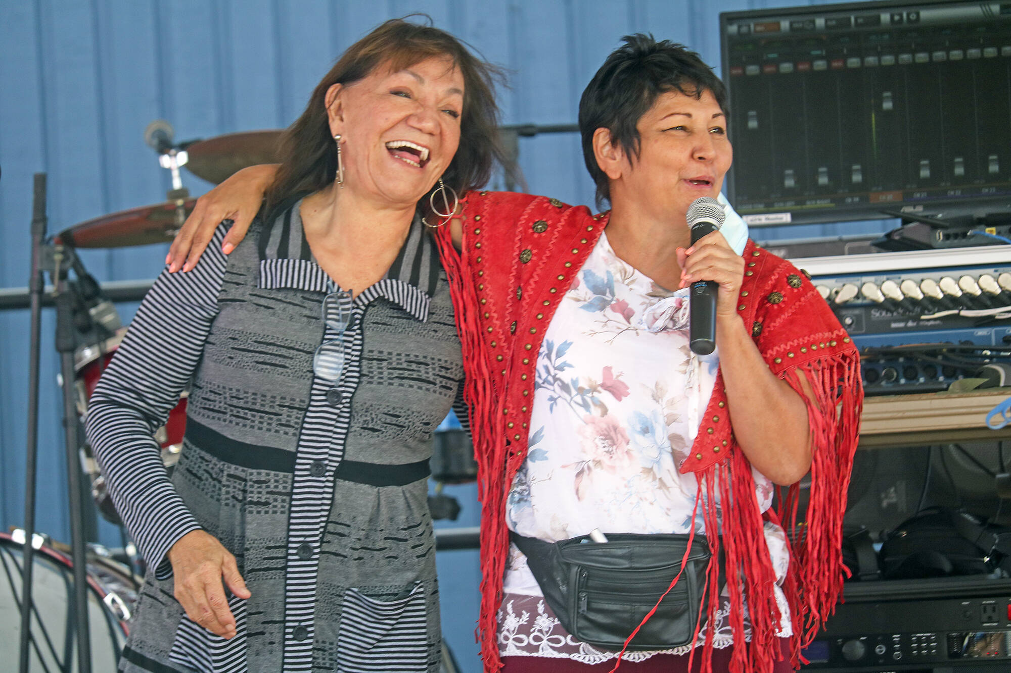 Abbie Crook, employment officer with the Soaring Eagle Friendship Centre, and Métis Bev Lambert greet guests to a Community Wellness event July 24. NNSL file photo