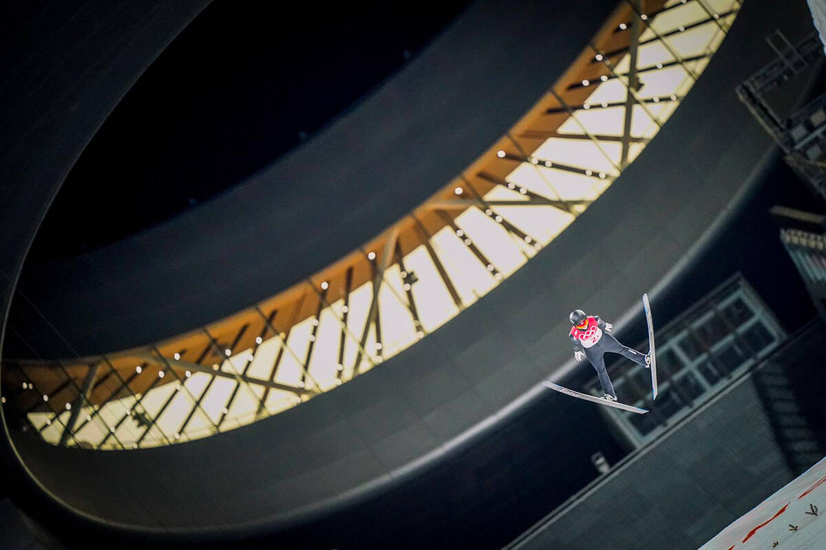 Alexandria Loutitt flies over a photographer during the 2022 Winter Olympics in Beijing. Loutitt flew 90 metres to help win Canada its first ever medal in ski jump. Photo courtesy of Alexandria Loutitt