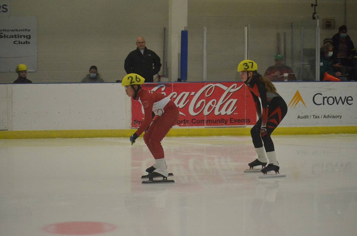 Kaia Parkes, right, drafts behind YellowknifeÂ’s Marcus Low during one of her races. James McCarthy/NNSL photo
