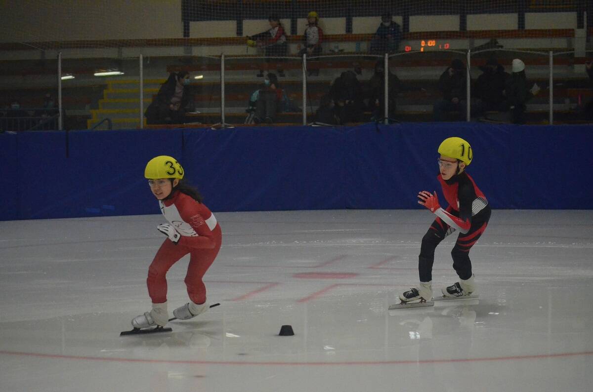 Lachlan Conway-Adams, right, keeps pace with YellowknifeÂ’s Kara Nelson. James McCarthy/NNSL photo