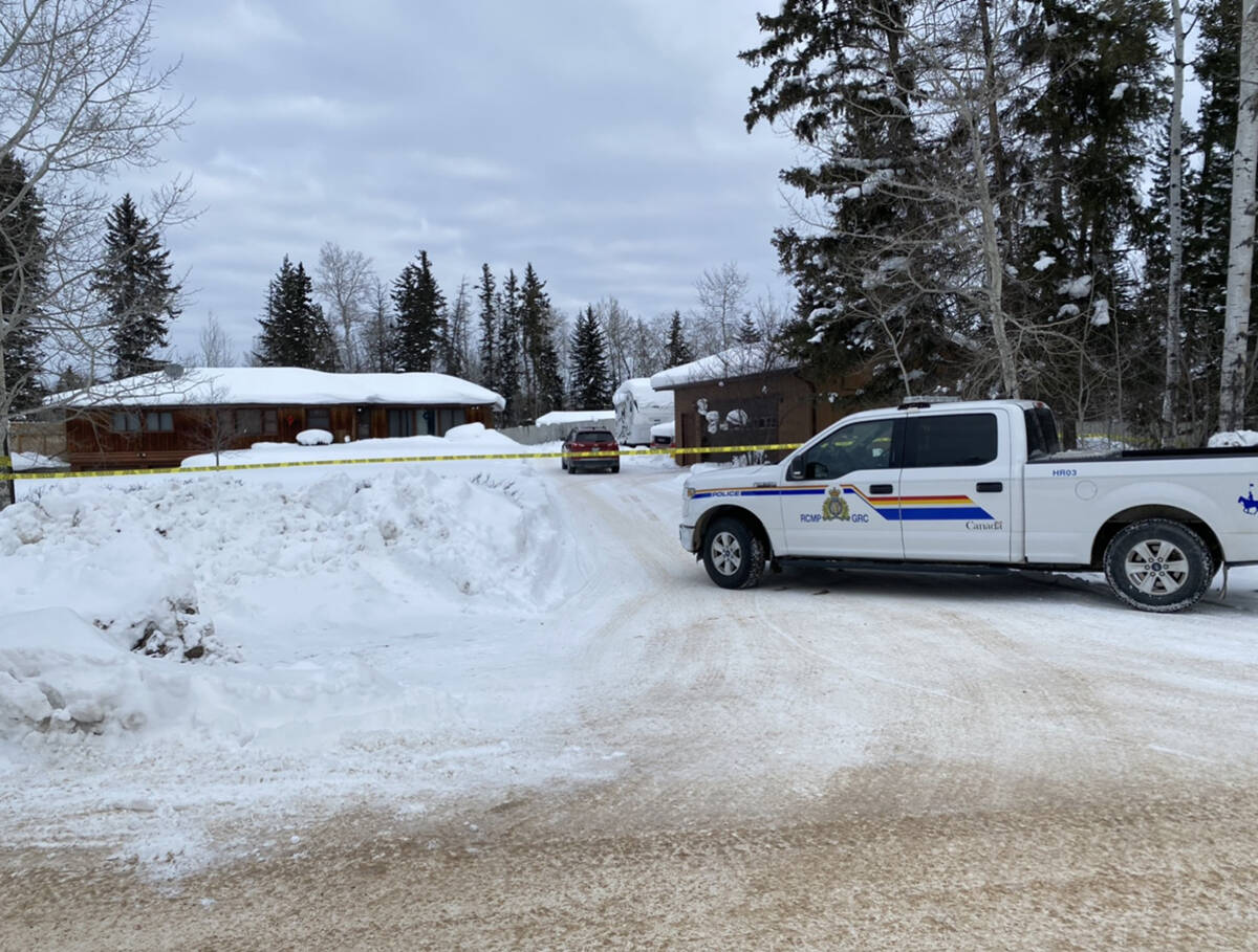 An vehicle sits outside one of the homes police taped off in Fort Smith March 4. Photo courtesy of Margaret McKay