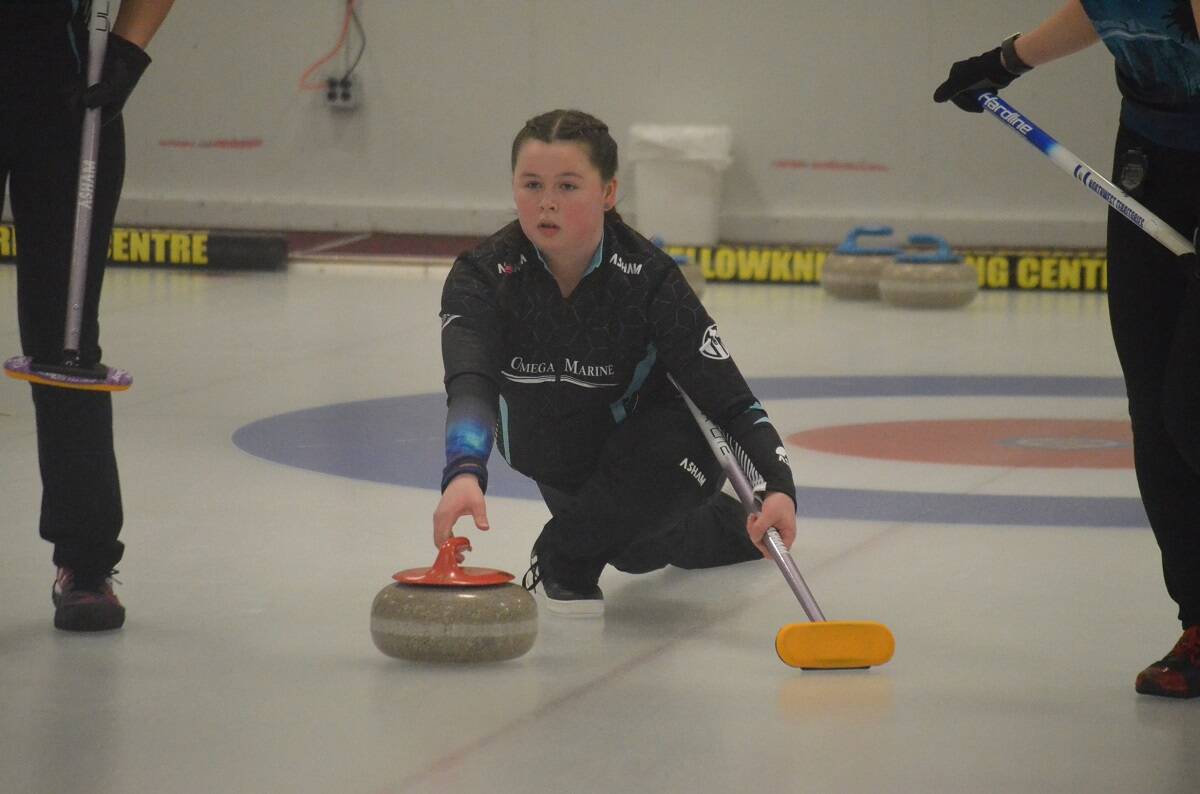 Sydney Galusha locks eyes on the broom as she delivers a thirds stone. James McCarthy/NNSL photo