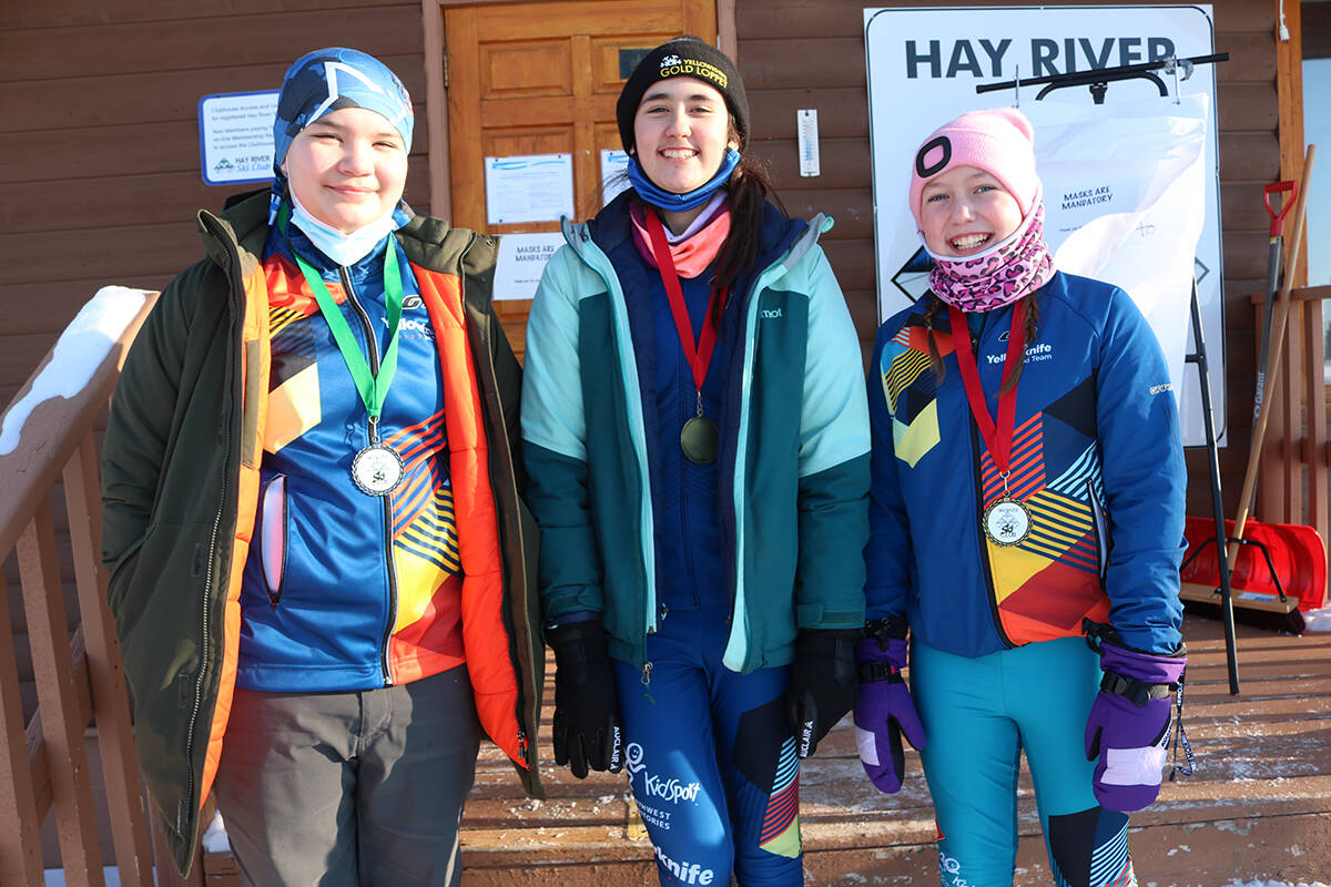 Penelope Berrub, left, Neve Mahon and Kate McShane show off some of the hardware they won this past weekend in Hay River. Simon Whitehouse/ºÚÁϳԹÏÍø photo