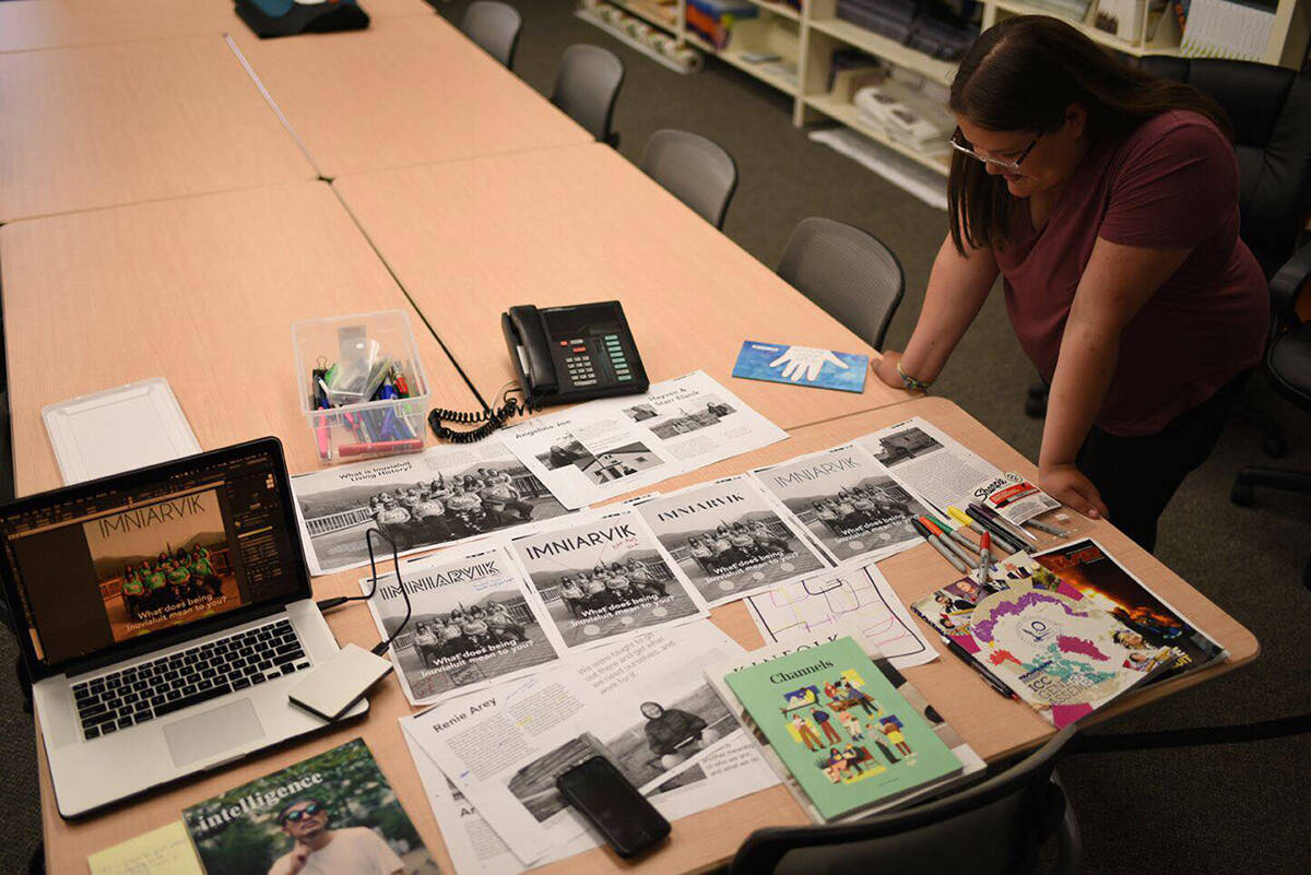 Mataya Gillis pores over proofs of the first edition of Nipaturuq, which published several editions related to youth issues in the North last year. NNSL file photo