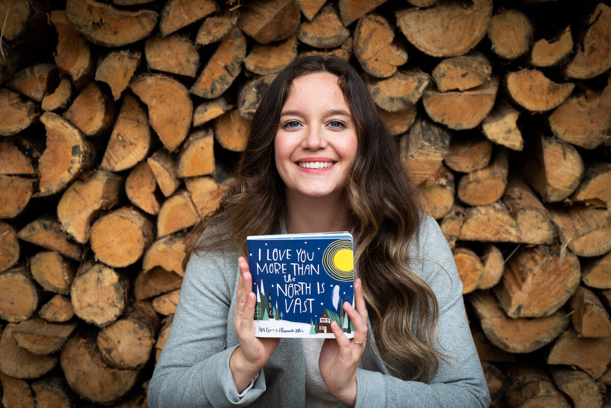 Isis Essery, holding a copy of I Love You More Than The North Is Vast, was the recipient of the NorthWords NWT聮s Youth Book Award handed out at the organization聮s Gather event on Saturday, April 2. Photo courtesy of Isis Essery