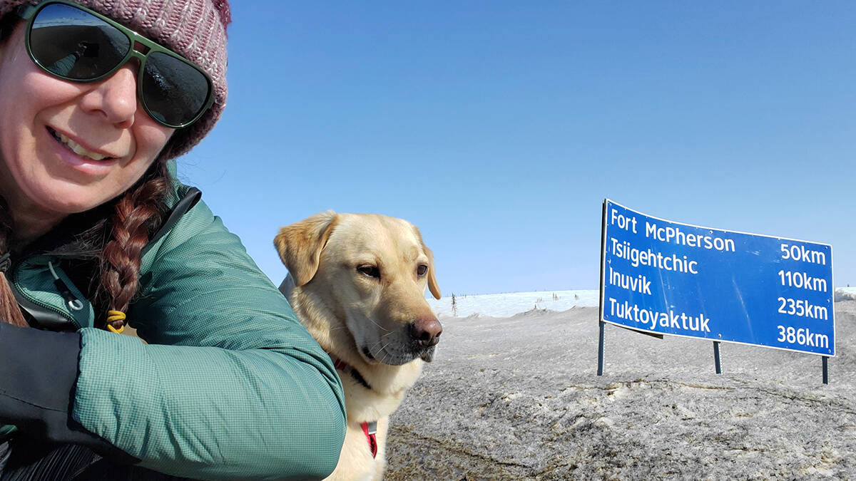 Melanie Vogel and Milo take a pause as the cross into the Northwest Territories after being held up in Eagle Plains for two years due to the Covid-19 pandemic. Photo courtesy of Melanie Vogel