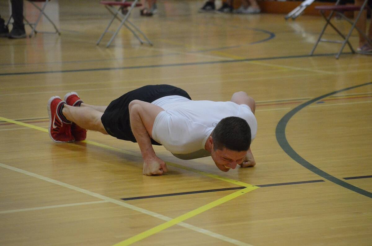 Chris Stipdonk of Yellowknife grits his way toward the 61-metre mark (200 ft.) in the open mens knuckle hop during the Indigenous Summer Games at St. Pats Gymnasium on Sunday. Stipdonk would better his own world record in the event, reaching a distance of 63.1 metres (207 ft.), a couple of metres better than his then-world-record distance of 61.2 metres (200 ft., 8 in.), set at the 2020 Arctic Winter Games trials in Inuvik.