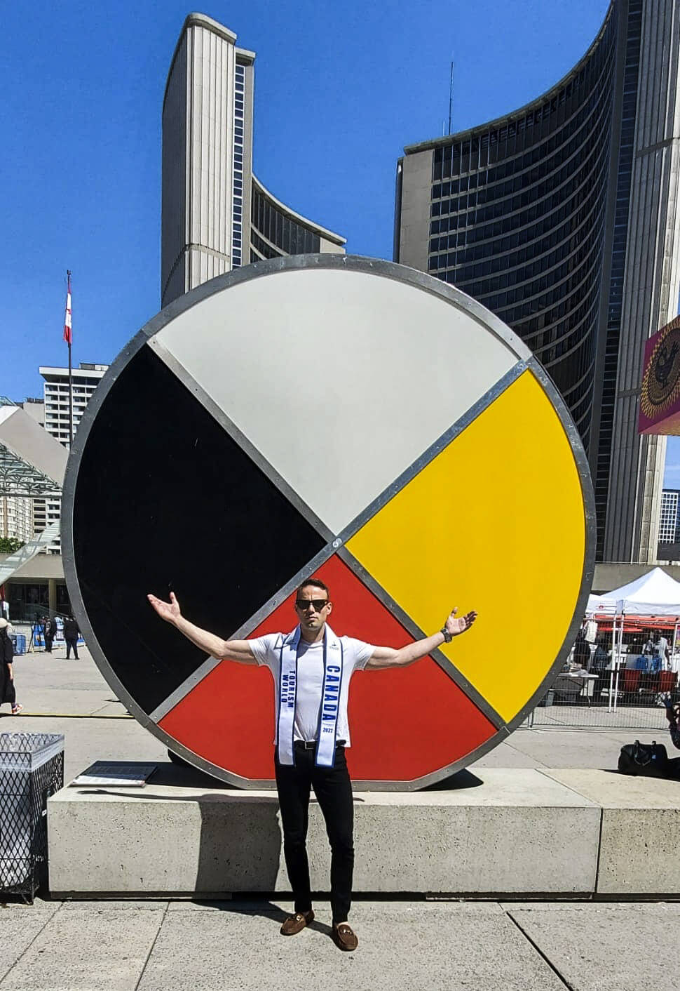 Drake Cairns, who was raised in Yellowknife, poses in front of Toronto city hall. Photo courtesy of Drake Cairns