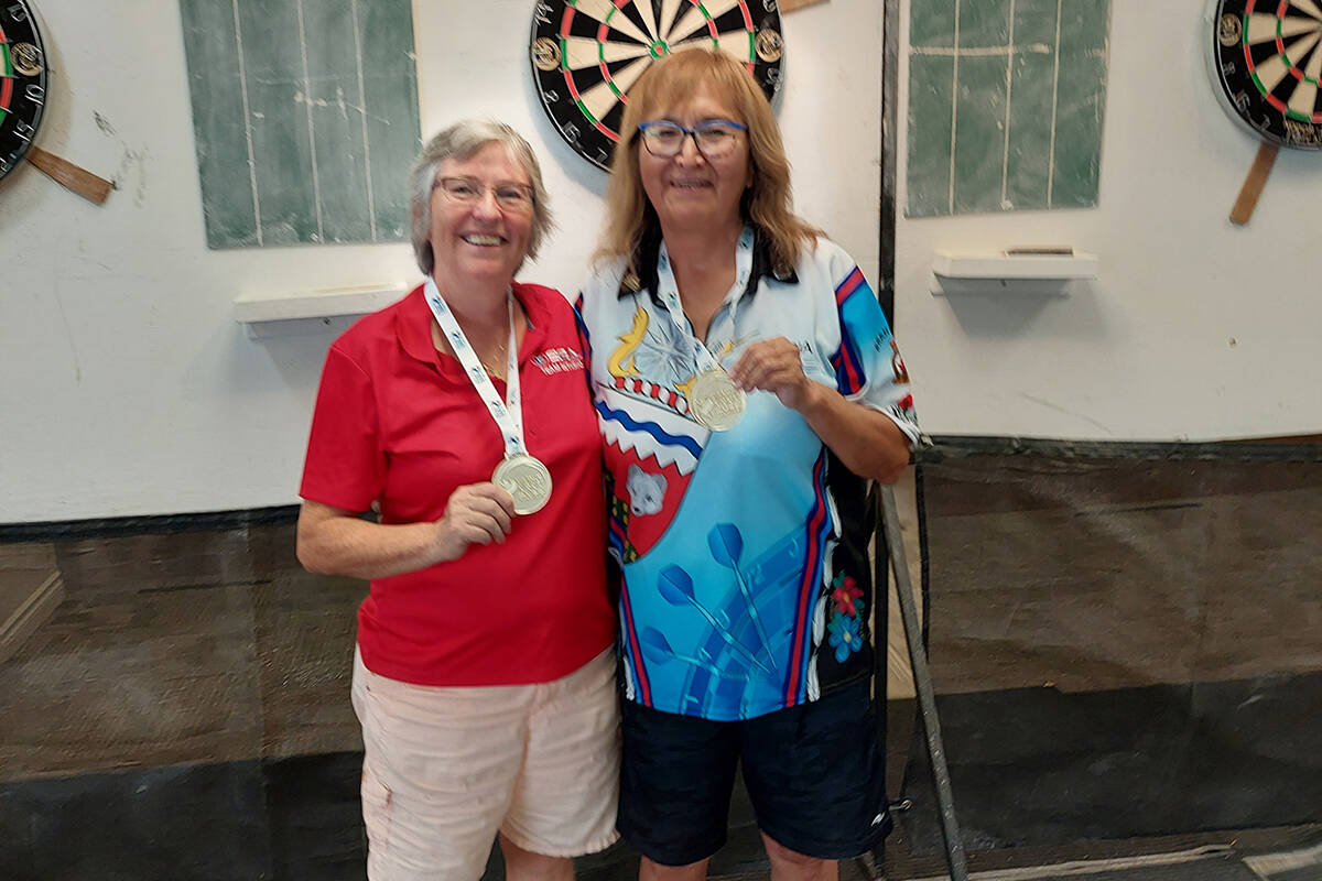 Our athlete of the week is Gloria Allen, seen here with teammate Janet Kennedy-Hynes from _. The duo just won gold medals in the 65-plus tier of darts at the Canada 55-plus games in Kamloops, B.C. This is the first time Allen has won gold in the sport. Photo courtesy of Gloria Allen