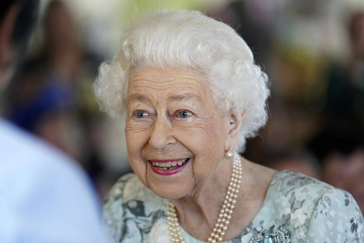 FILE - Britain's Queen Elizabeth II looks on during a visit to officially open the new building at Thames Hospice, Maidenhead, England July 15, 2022. Buckingham Palace says Queen Elizabeth II is under medical supervision as doctors are SA国际影视传媒渃oncerned for Her MajestySA国际影视传媒檚 health.SA国际影视传媒 The announcement comes a day after the 96-year-old monarch canceled a meeting of her Privy Council and was told to rest. (Kirsty O'Connor/Pool Photo via AP, File)