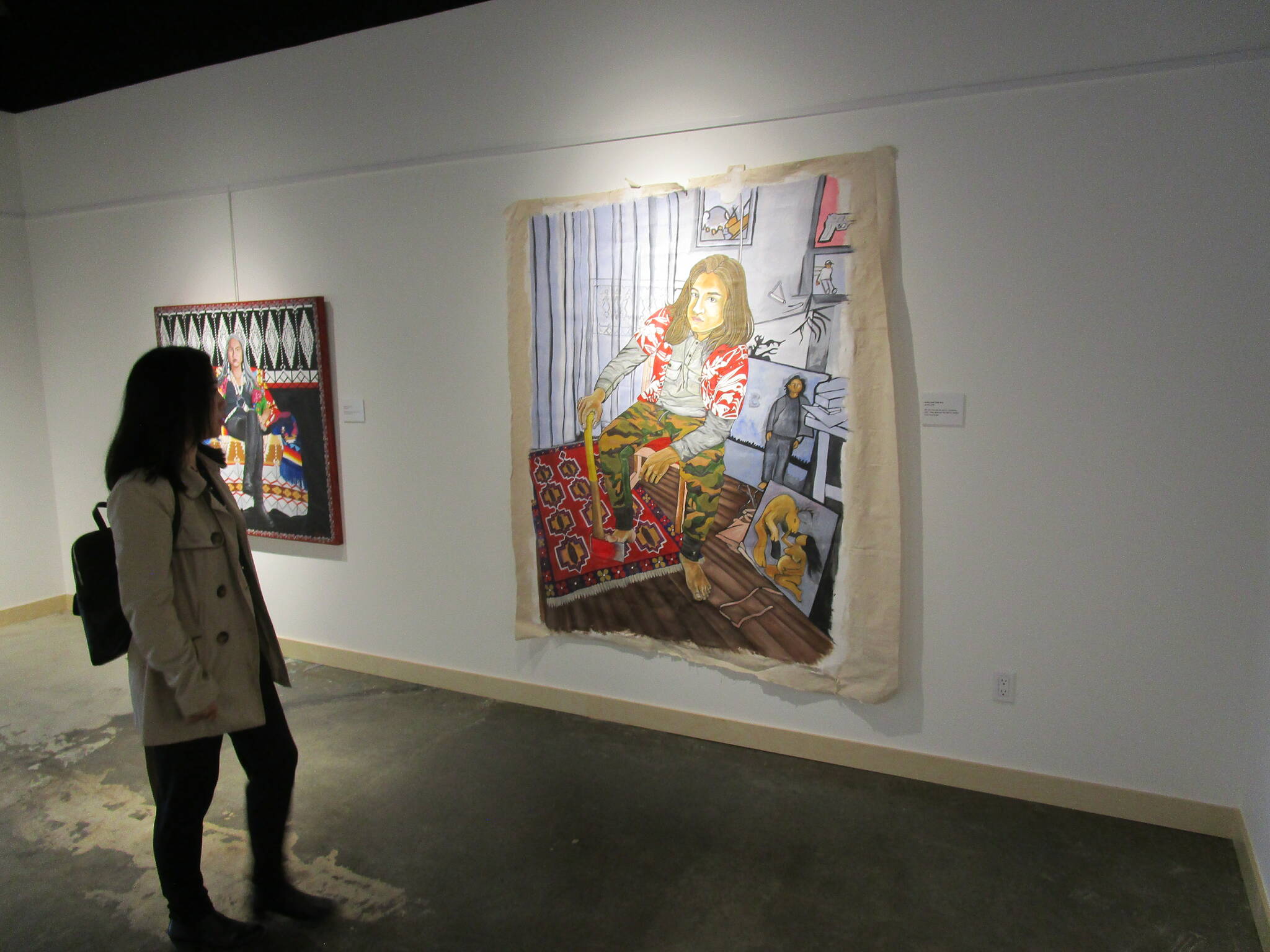 Kristen Au Johnston, a director for the Yellowknife Chamber of Commerce, observes the facility聮s art gallery. Jonathan Gardiner/NNSL photo