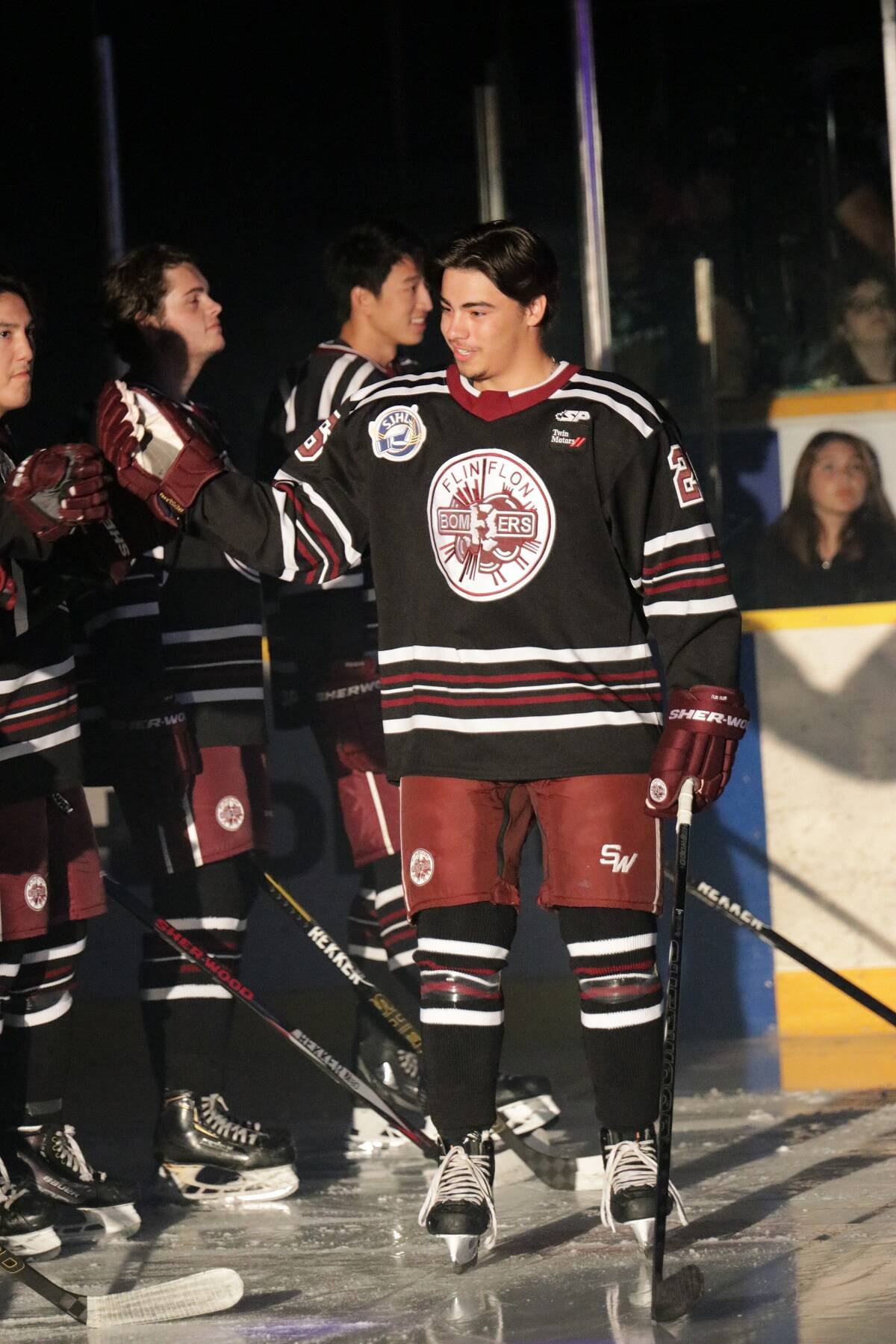 Right-winger Carter McLeod high-fives his teammates during the player introductions at the home opener for the Flin Flon Bombers in Flin Flon, Man., on Sept. 16. Photo courtesy of Kelly Jacobson