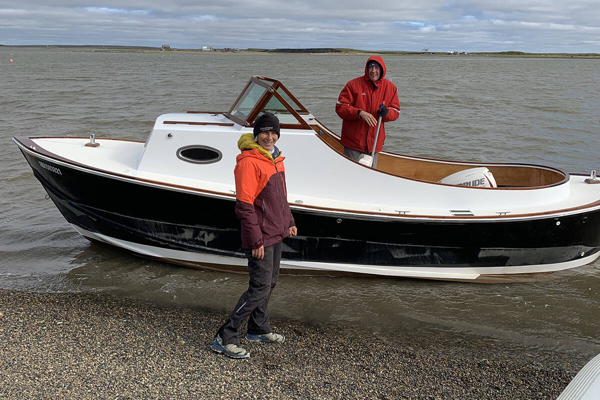 Alex and Sheila Gurba with AlexSA国际影视传媒檚 homemade boat, which they drove up the Dempster all the way from Alberta to dip into the Arctic Ocean in Tuktoyaktuk. Photo courtesy of Alex Gurba