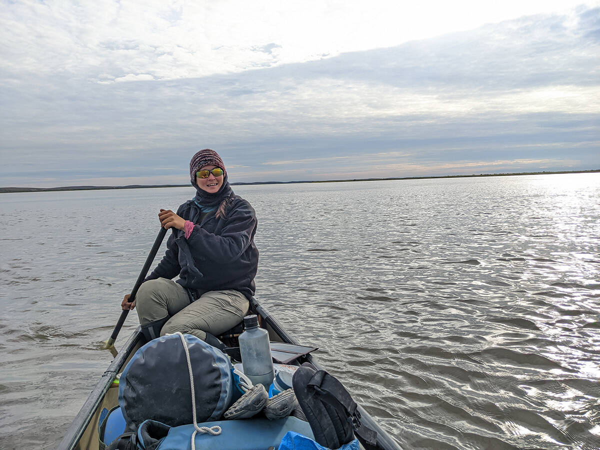Lauren Reed handles one side of the canoe as the pair make their way down the mouth of the Beaufort Delta. Photo courtesy of Bethany Hughes and Lauren Reed
