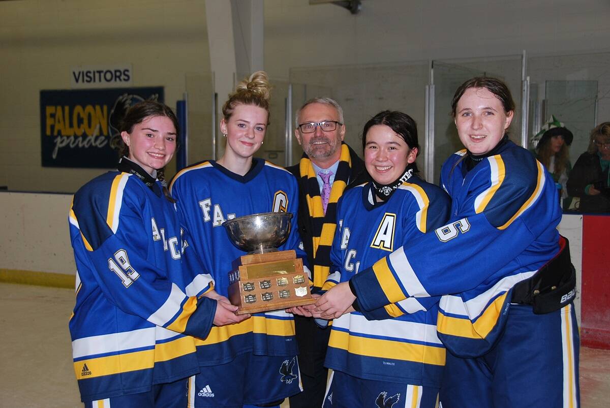 Sir John Franklin High School successfully defended its title in the Wade Hamer Challenge Cup girls game at the Multiplex on Wednesday. With the trophy are, from left, Erika Pollard, Emma Carey, Sir John Franklin principal Dean MacInnis, Teresa Martin and Brooklyn Helyar. James McCarthy/NNSL photo
