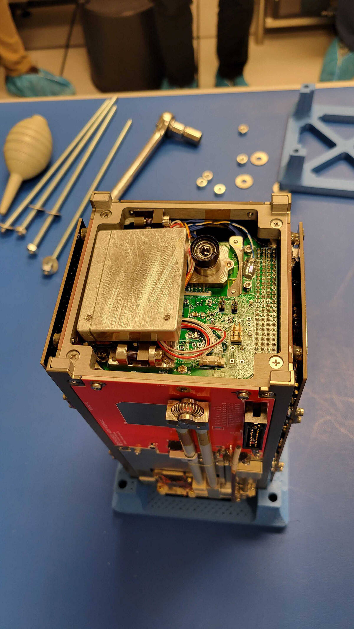                                             The Northern Images Mission payload mounted to the front end of AuroraSat. The display screen will flip out and the camera will take photos of the scene from orbit. Photo courtesy of Patrick Gall          