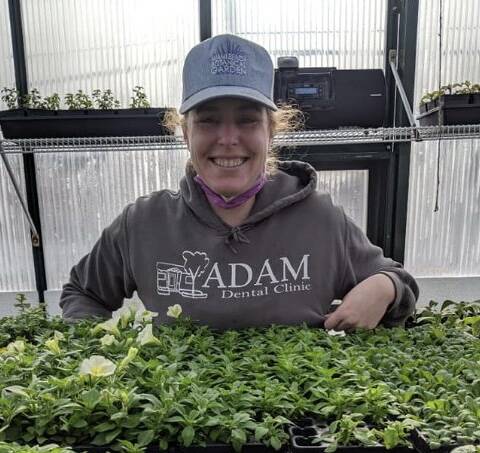 Gardening is basically a year-round job. In the summertime, horticulturalist Leslie Creed plans for what will go in the garden next year. Photo courtesy of Adam Dental Clinic