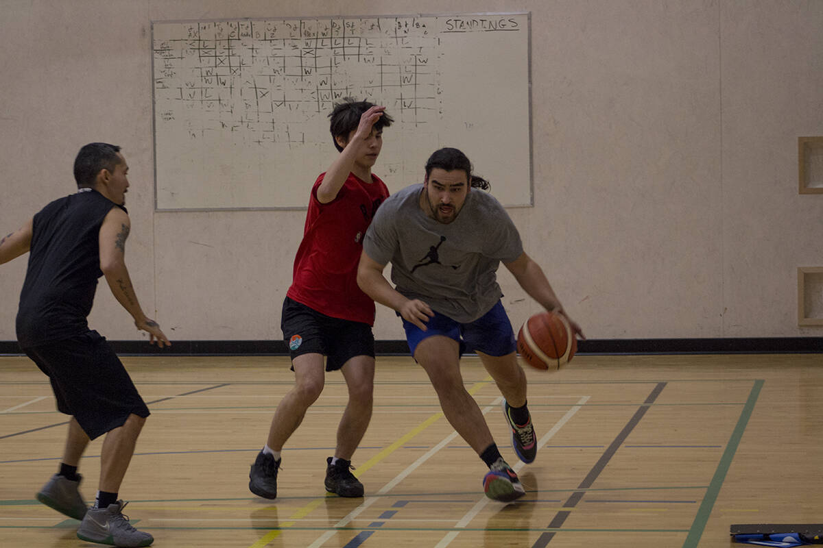 Jackson Christi dribbles past Kolsen Church while Bryan Wood backpedals. Eric Bowling/NNSL photo