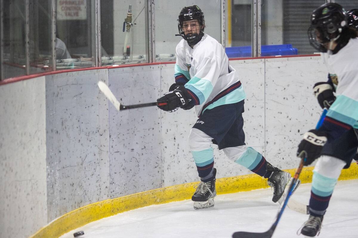 Ryder Wicks plays the puck around the boards during U16 boys hockey action on Monday. Photo courtesy of Team NT