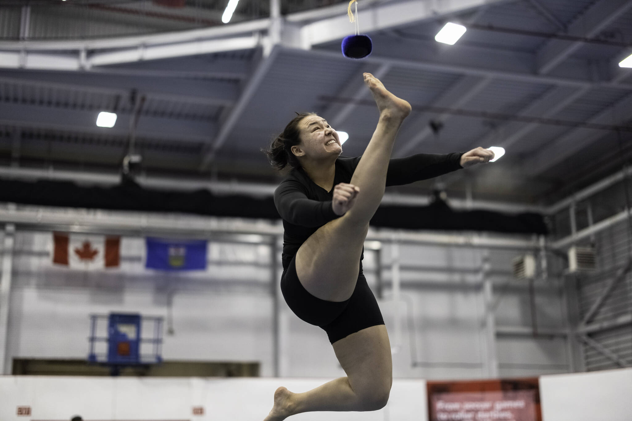 Danica Taylor shows the form she uses on approach to the one-foot high kick. She earned gold in the open women聮s category Wednesday, Feb. 1. Stewart Burnett/NNSL photos