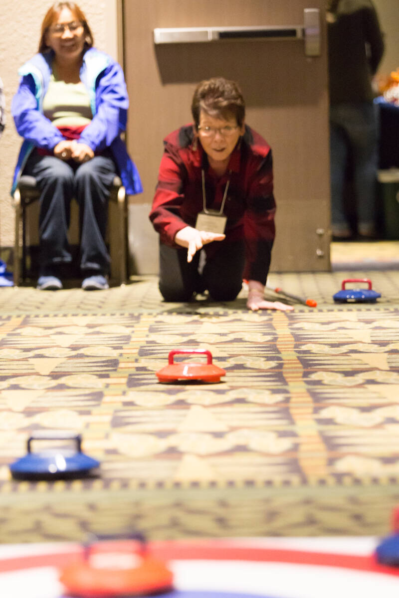 Anne Firth Jones participates in carpet curling at an NWTRPA Conference. Photo courtesy of NWTRPA