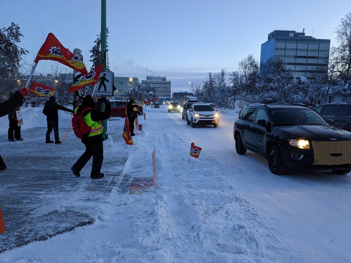 Protesters cheer as people drive by and honk their horns in support. Jonathan Gardiner/NNSL photo
