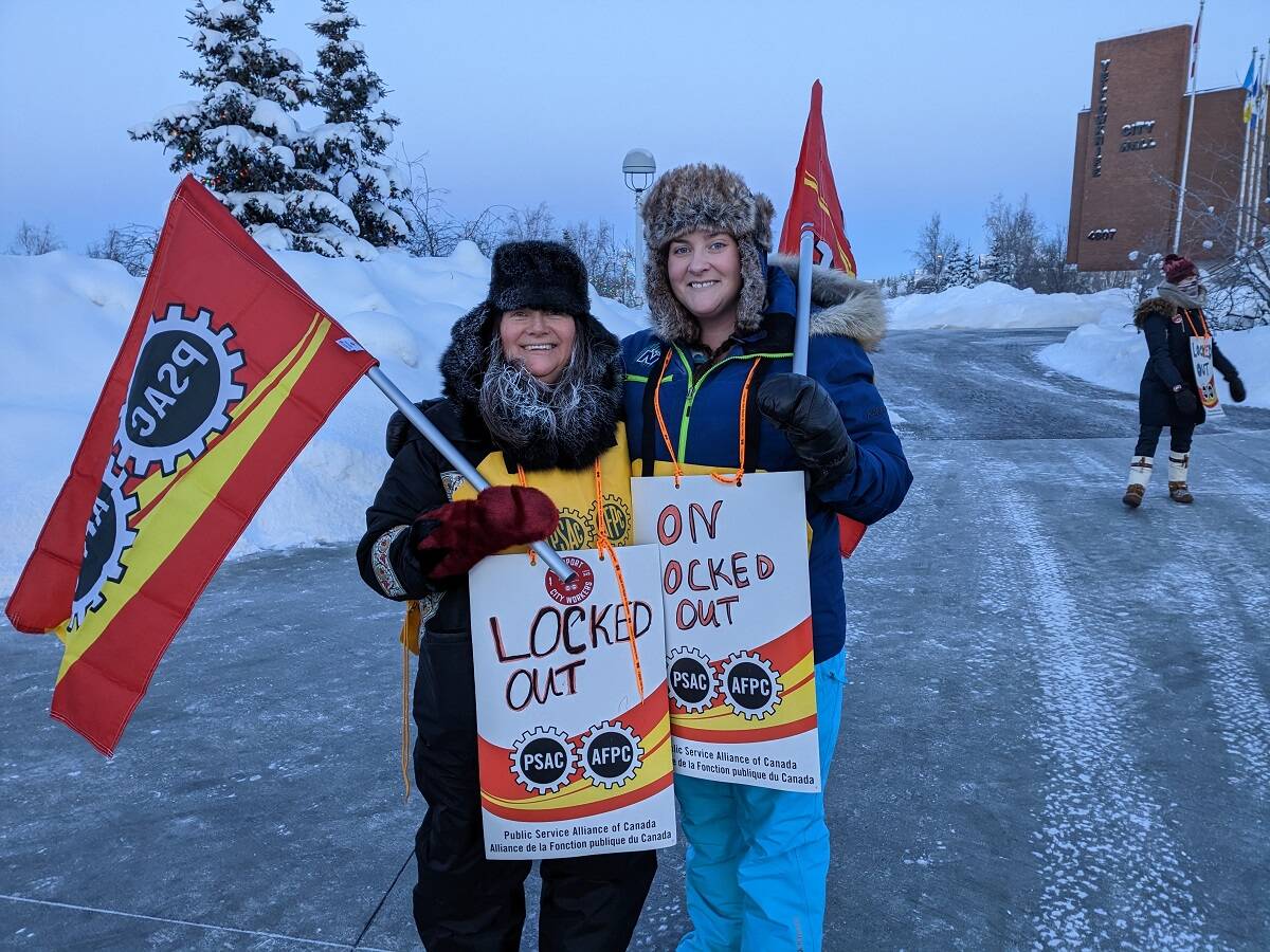 Geraldine Penney, left, and Reilly Hinchey expressed her frustration at having to protest. The fact that were out here to get fair wages, thats all were really asking for. It should be a lot easier than it is but here we are, said Hinchey. Jonathan Gardiner/NNSL photo