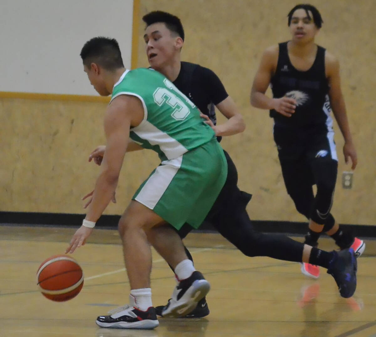Our Youth of the Week is Dwayne Raddi, seen here playing defence at the 2023 NTPC Senior Cager basketball tournament in Yellowknife. Raddi and the entire East Three basketball team went undefeated to win the tournament, crowning a strong year of hoops. James McCarthy, NNSL photo