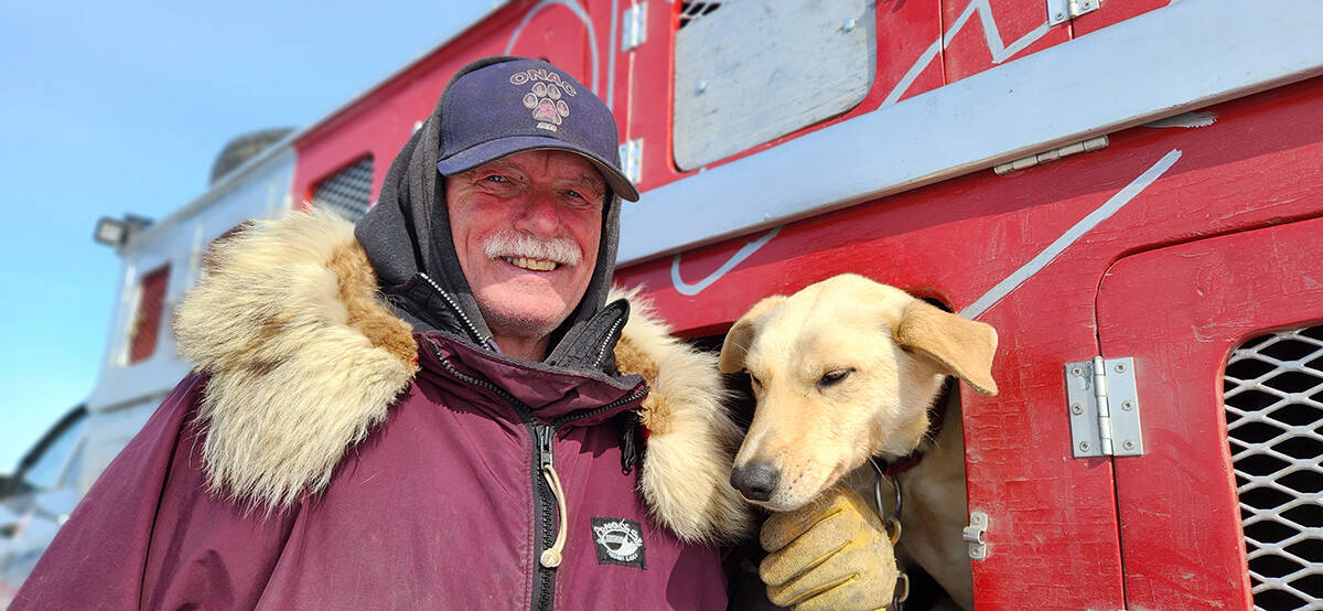 Don Cousins with one of his sled dogs getting ready for the 2023 Beluga Jamboree dog races in Tuktoyaktuk on April 30. Photo courtesy Karli Zschögner