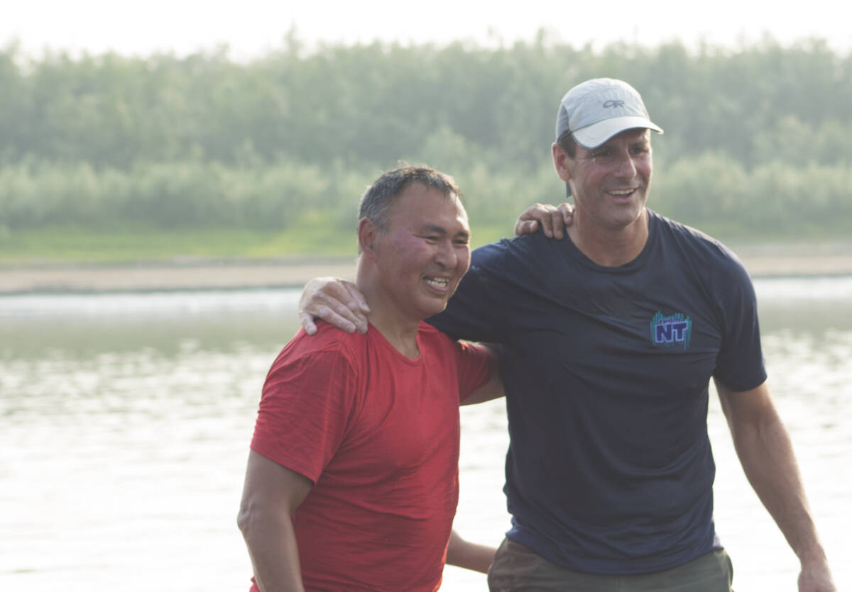 Men聮s first place team Tim Gordon and Kendall McDonald remember the joy of standing on solid ground as they step onto the dock. Eric Bowling/NNSL photo